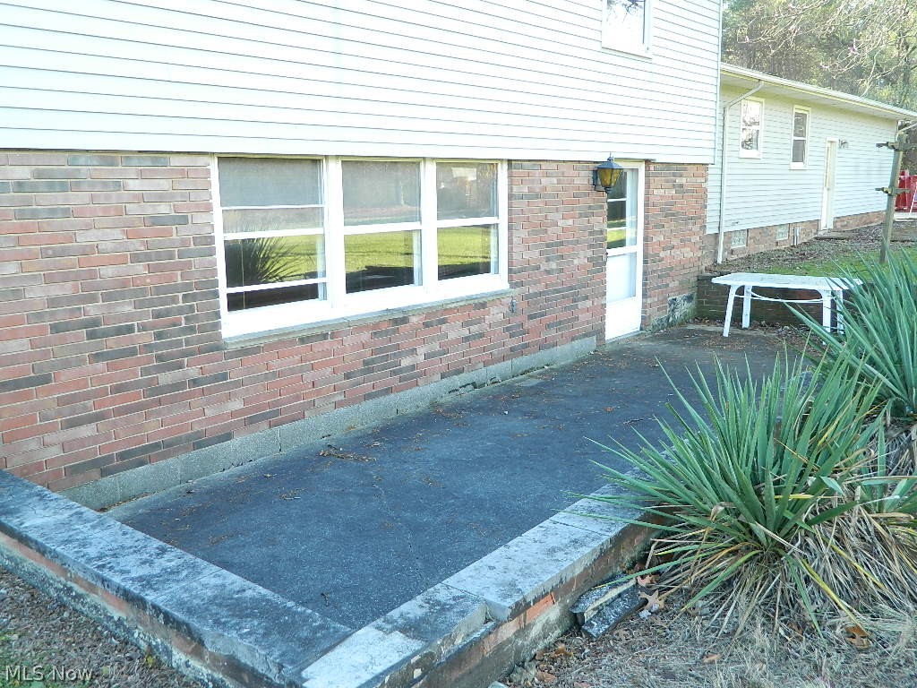 9284 Mayfield Road Chesterland, OH 44026 - Photo 11 of 33 Expansive Concrete Patio Just off the Family Room