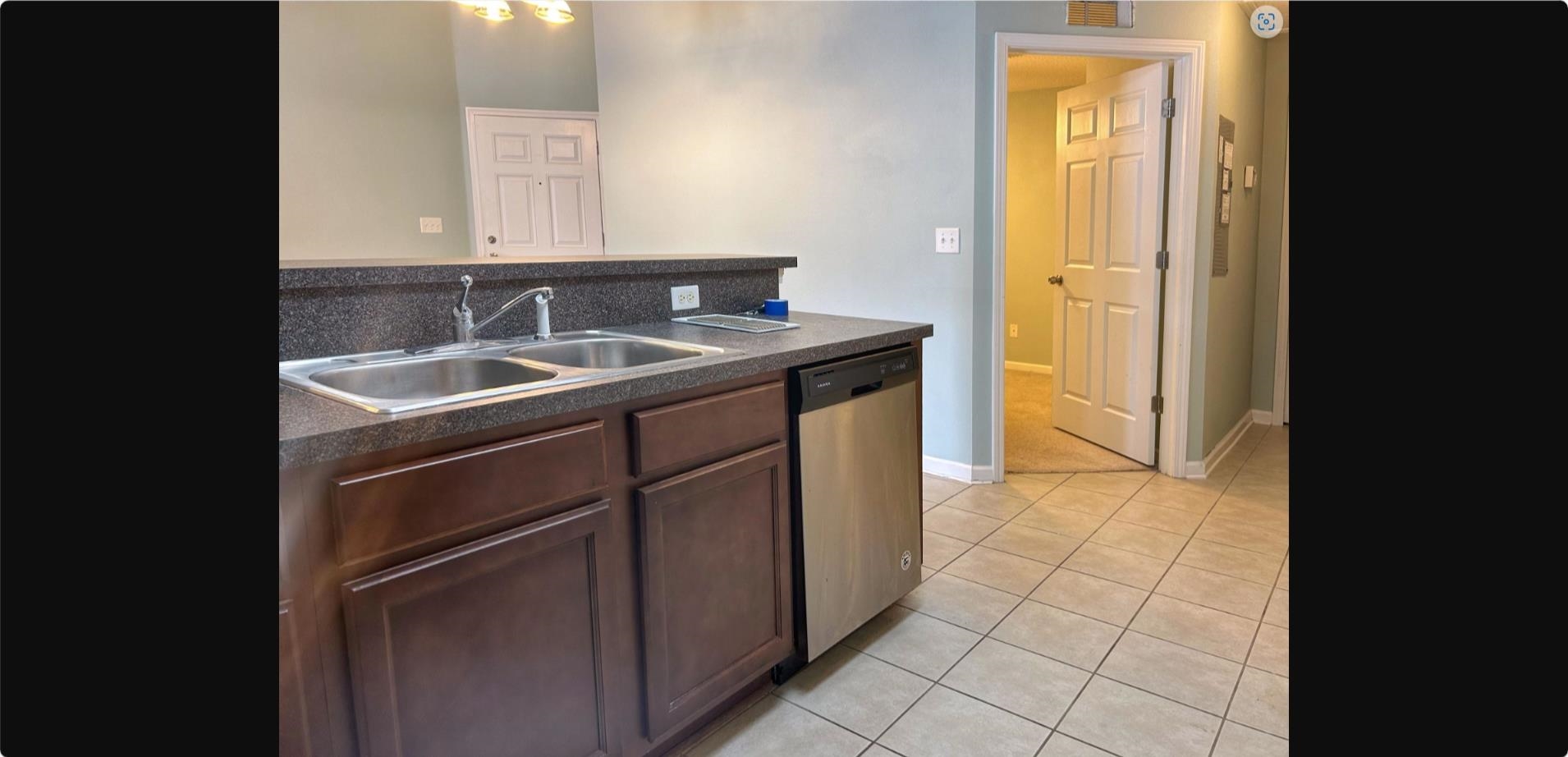 240 Golden Lake Loop St. Augustine, FL 32084 - Photo 16 of 19 a kitchen with a sink and a refrigerator