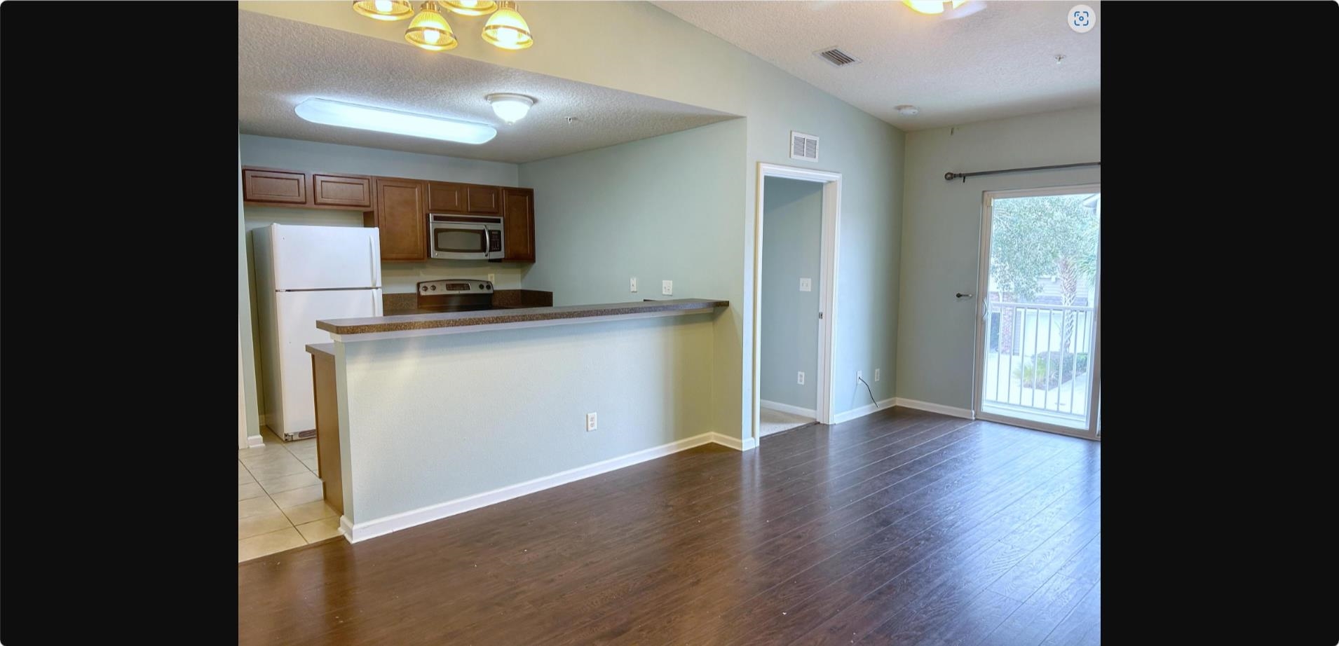 240 Golden Lake Loop St. Augustine, FL 32084 - Photo 17 of 19 a view of a kitchen with a sink and a refrigerator