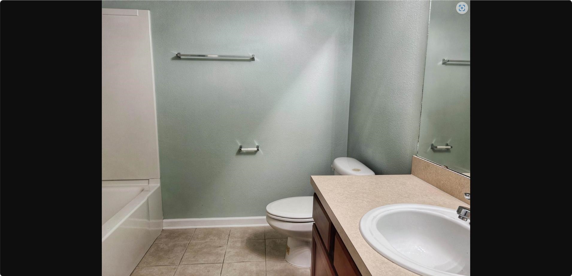 240 Golden Lake Loop St. Augustine, FL 32084 - Photo 7 of 19 a bathroom with a granite countertop toilet and a sink