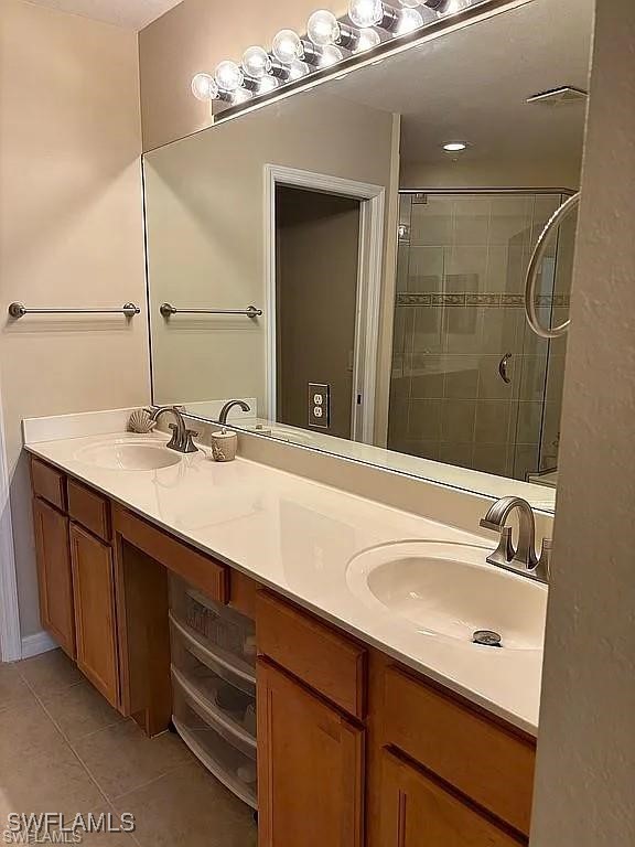 17619 Brickstone Loop Fort Myers, FL 33967 - Photo 21 of 38 a bathroom with a sink double vanity and a mirror