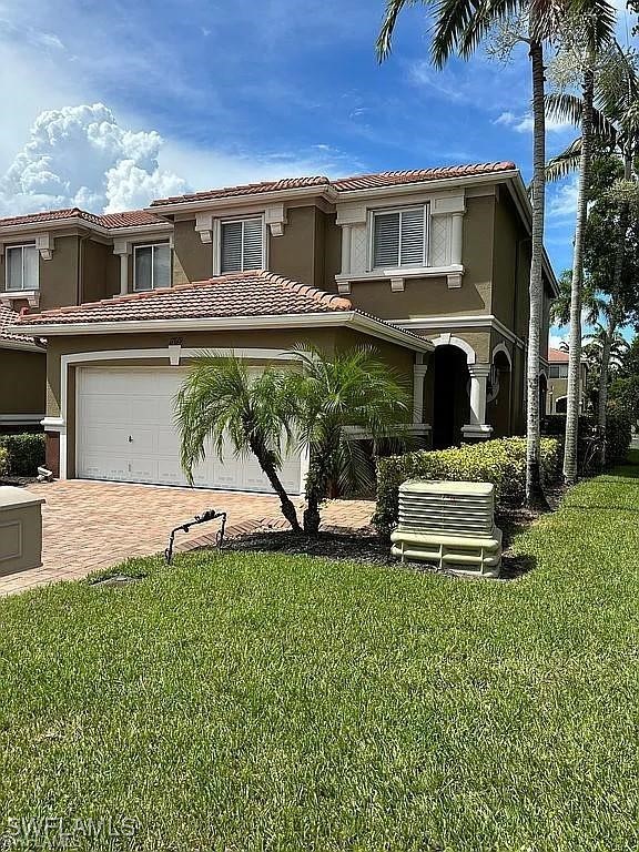 17619 Brickstone Loop Fort Myers, FL 33967 - Photo 3 of 38 a house view with a garden space