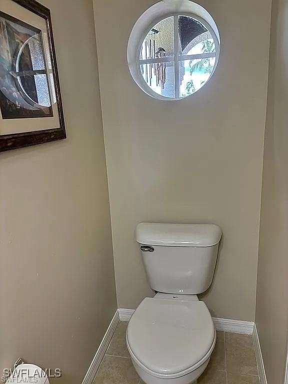 17619 Brickstone Loop Fort Myers, FL 33967 - Photo 32 of 38 a white toilet sitting next to a window