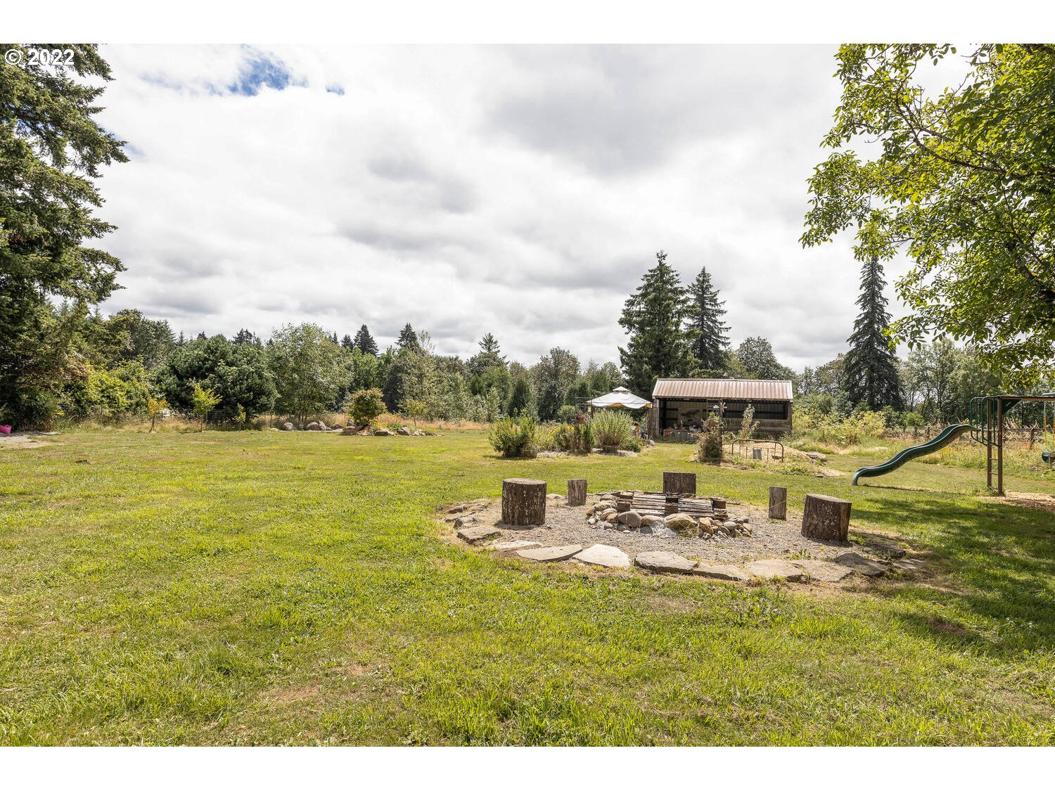 41584 Southeast Thomas Road Sandy, OR 97055 - Photo 17 of 32 a view of a lake with a yard