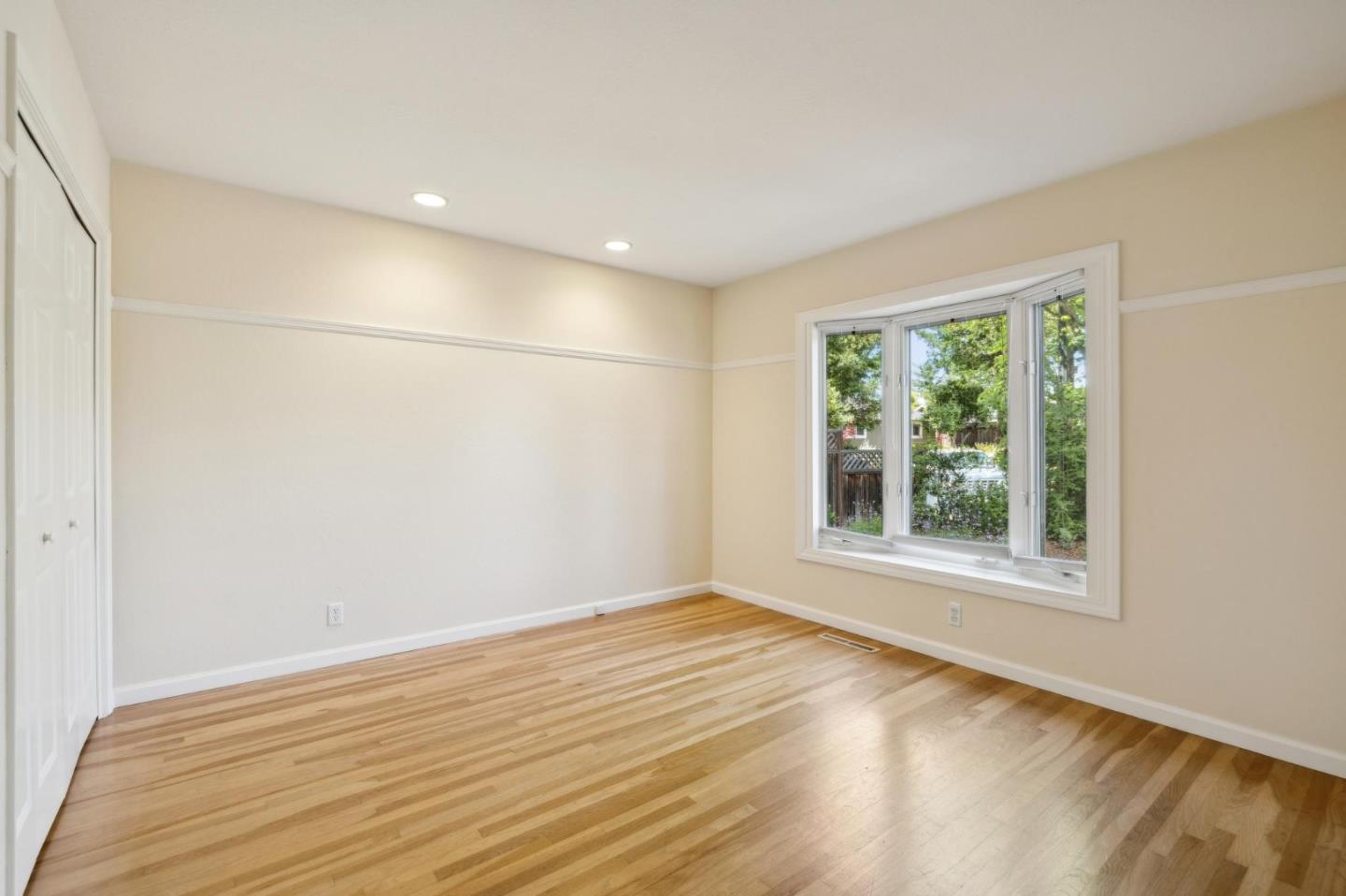 116 Vallecitos Way Los Gatos, CA 95032 - Photo 41 of 66 a view of an empty room with wooden floor and a window