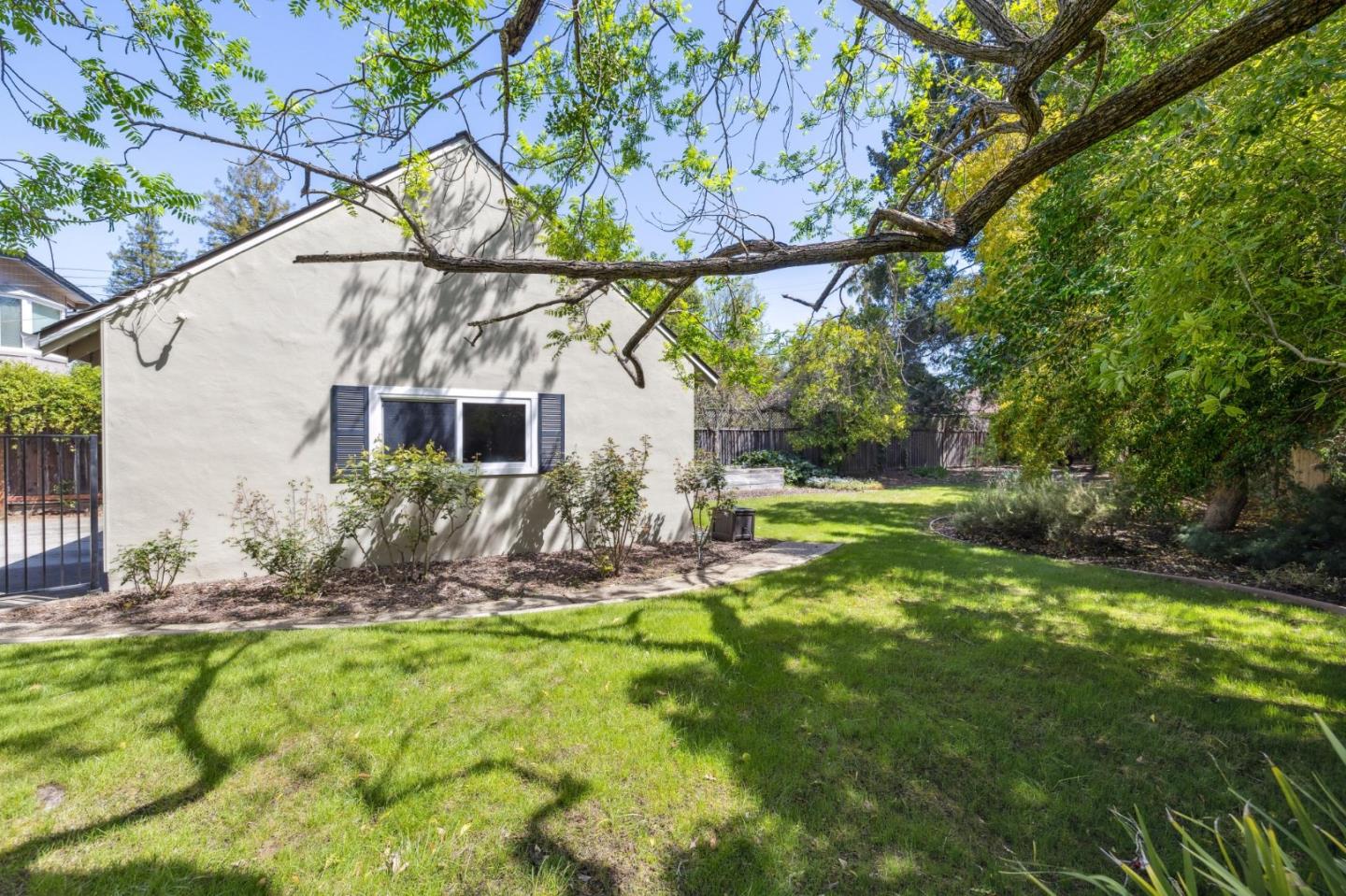 116 Vallecitos Way Los Gatos, CA 95032 - Photo 52 of 66 a backyard of a house with table and chairs plants and large tree