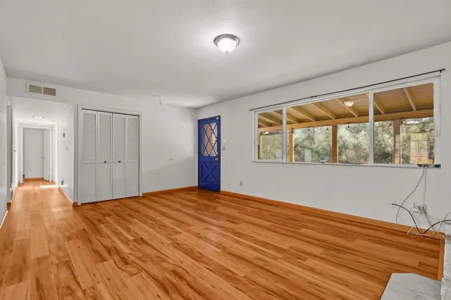 a kitchen with stainless steel appliances a stove a refrigerator and cabinets
