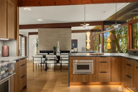 a kitchen with stainless steel appliances granite countertop a stove and a refrigerator