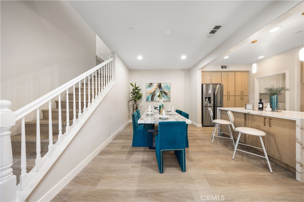 15525 Bonsai Way Tustin, CA 92782 - Photo 11 of 40 a view of a dining room with furniture window and wooden floor