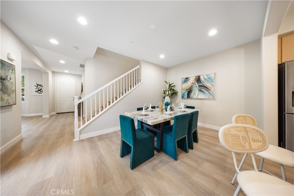 15525 Bonsai Way Tustin, CA 92782 - Photo 12 of 40 a view of dining room and hall with wooden floor
