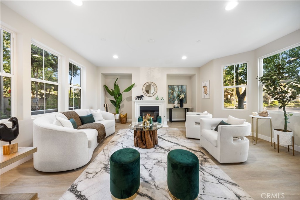 15525 Bonsai Way Tustin, CA 92782 - Photo 2 of 40 a living room with fireplace furniture and a large window