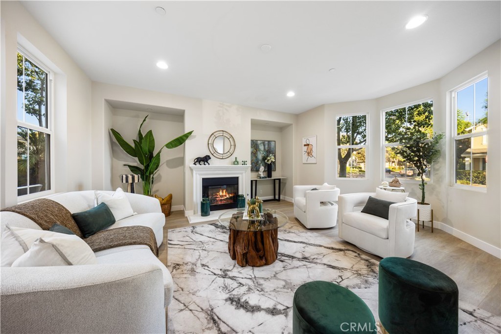15525 Bonsai Way Tustin, CA 92782 - Photo 3 of 40 a living room with furniture fireplace and window