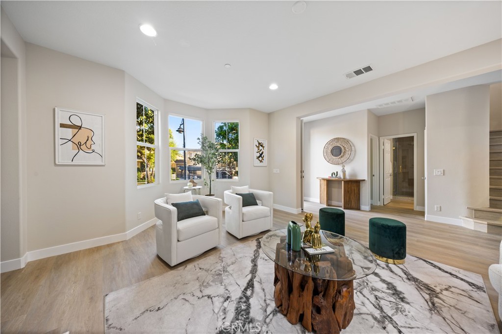 15525 Bonsai Way Tustin, CA 92782 - Photo 4 of 40 a living room with furniture and wooden floor