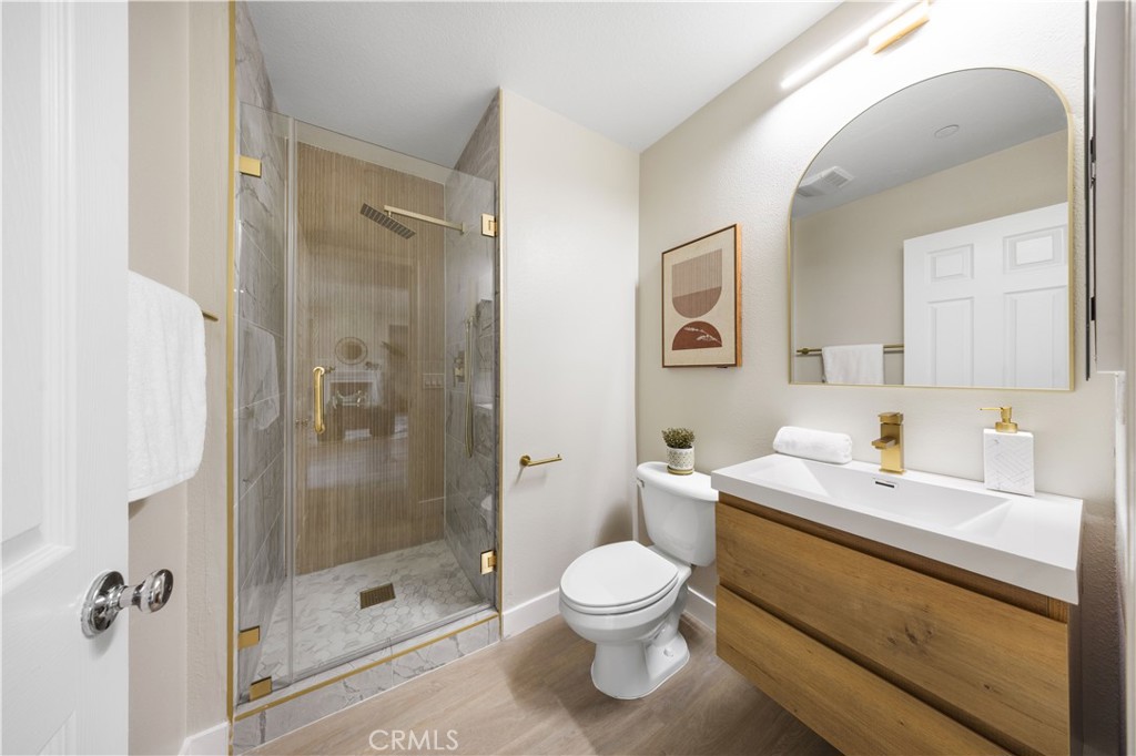 15525 Bonsai Way Tustin, CA 92782 - Photo 7 of 40 a bathroom with a sink toilet and shower