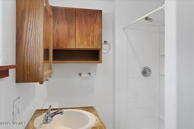a bathroom with a sink and a mirror