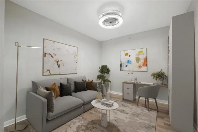 a living room with furniture and a table