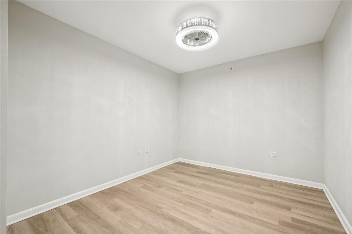 800 Elgin Road, Unit 1013 Evanston, IL 60201 - Photo 15 of 25 a view of a room with wooden floor