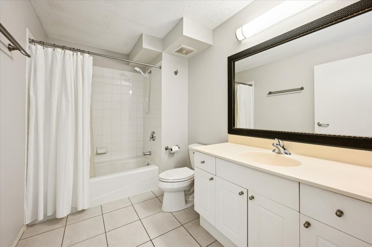 800 Elgin Road, Unit 1013 Evanston, IL 60201 - Photo 17 of 25 a bathroom with a sink toilet and shower