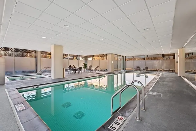 a room with lots of chairs and a table