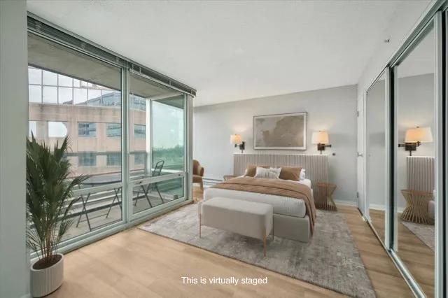 a bedroom with a large bed and a large window