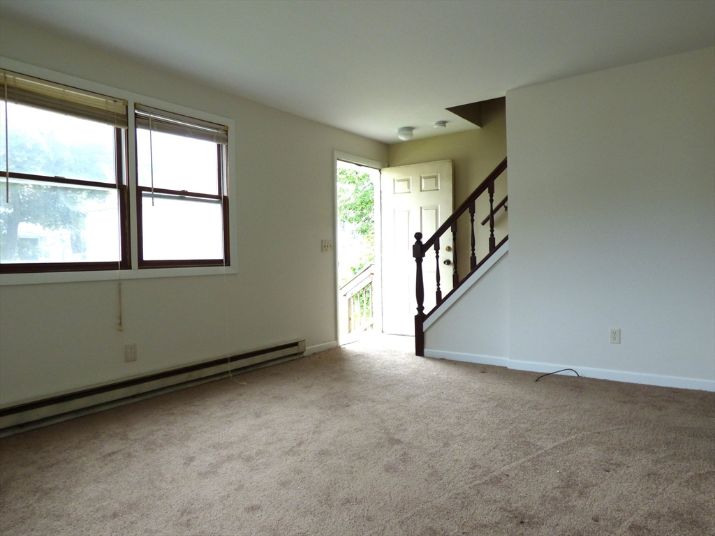 26-28 Daniel Street Springfield, MA 01151 - Photo 9 of 15 an empty room with windows