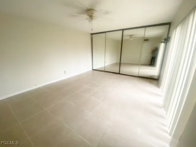 a view of an empty room with a fireplace