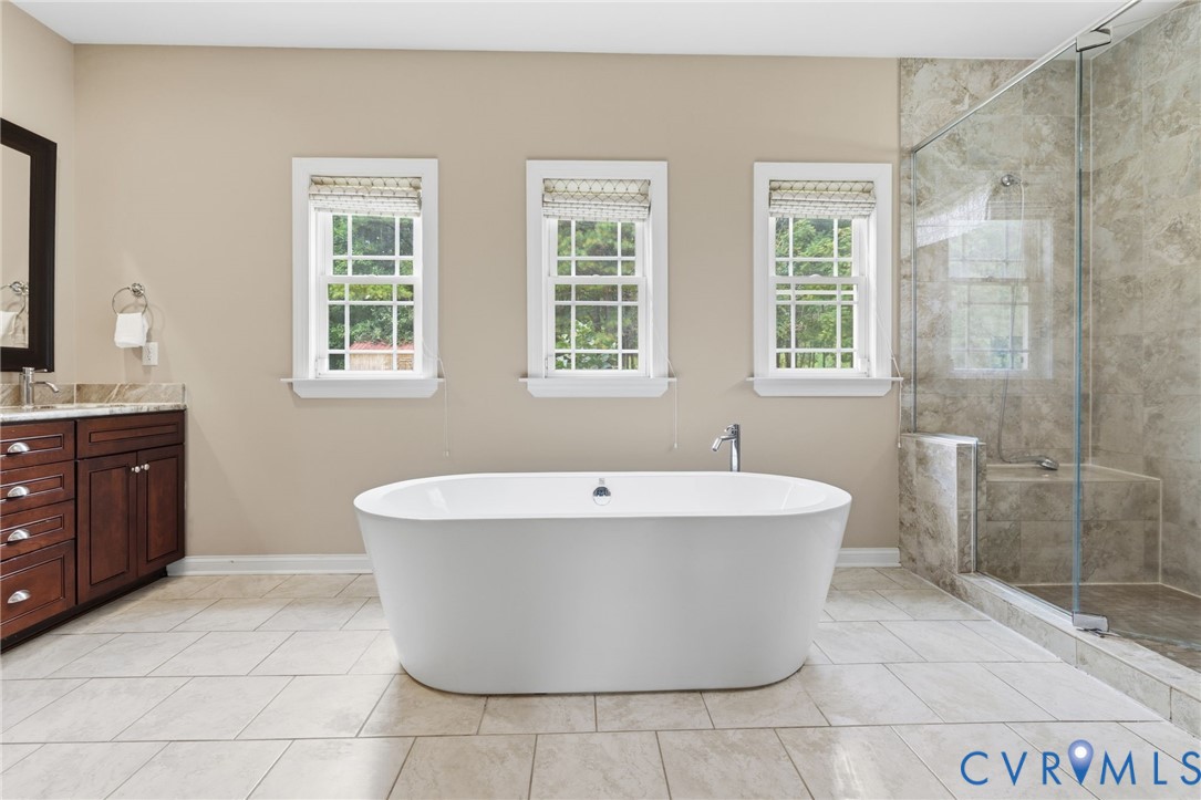 15220 River Road Chesterfield, VA 23838 - Photo 26 of 65 Freestanding soaking tub with a floor-mounted fauc