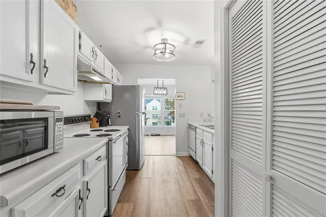 a bedroom with a bed and a tv