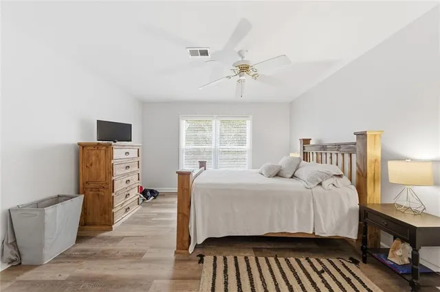 a bedroom with a bed and a dresser