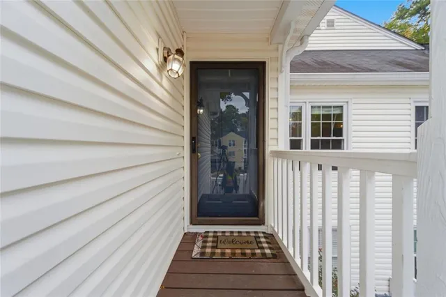a view of a house with a door and wooden floor