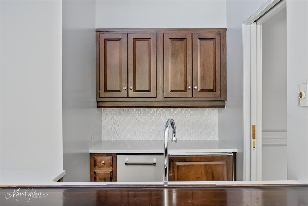 10405 Ellerbe Road Shreveport, LA 71106 - Photo 17 of 40 a view of a kitchen with white cabinets