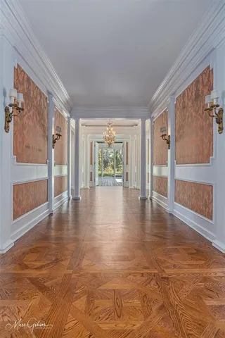 a view of an entryway with wooden floor