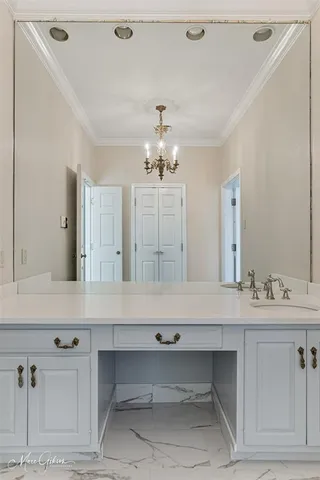 a bathroom with a sink vanity and mirror