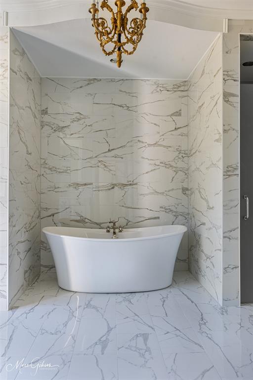 10405 Ellerbe Road Shreveport, LA 71106 - Photo 32 of 40 a white bath tub sitting in a bathroom