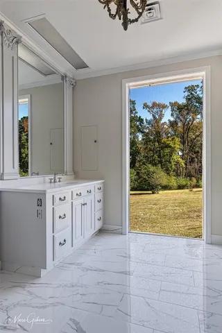 a bathroom with a tub sink and mirror