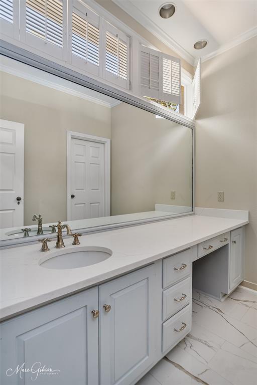 10405 Ellerbe Road Shreveport, LA 71106 - Photo 34 of 40 a bathroom with a sink and a mirror