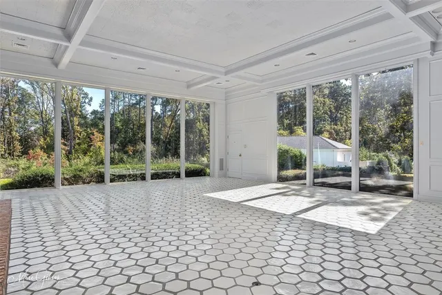 a view of a porch with chairs and yard