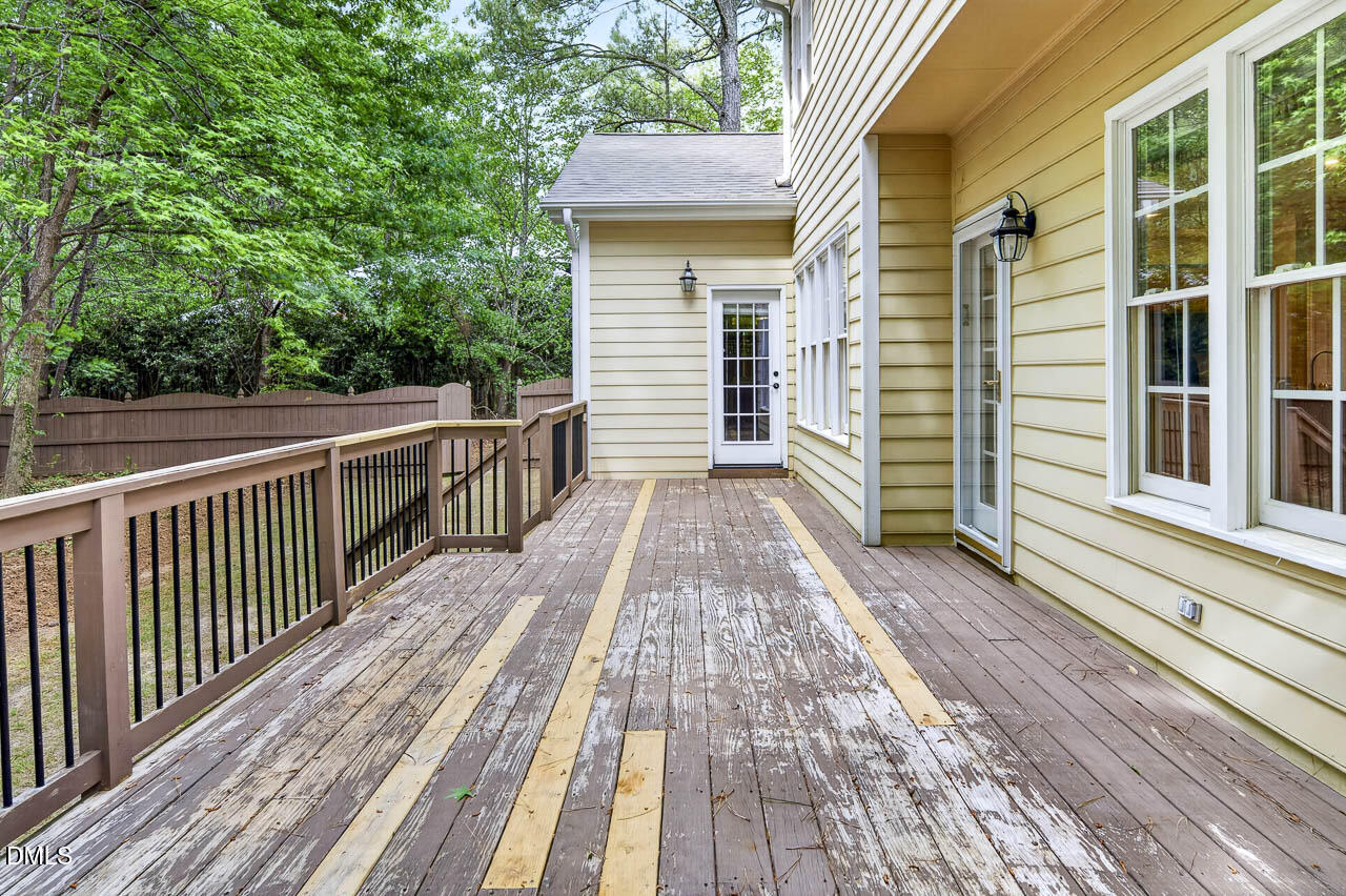 2209 Lodestar Drive Raleigh, NC 27615 - Photo 49 of 50 a view of a wooden deck with a yard
