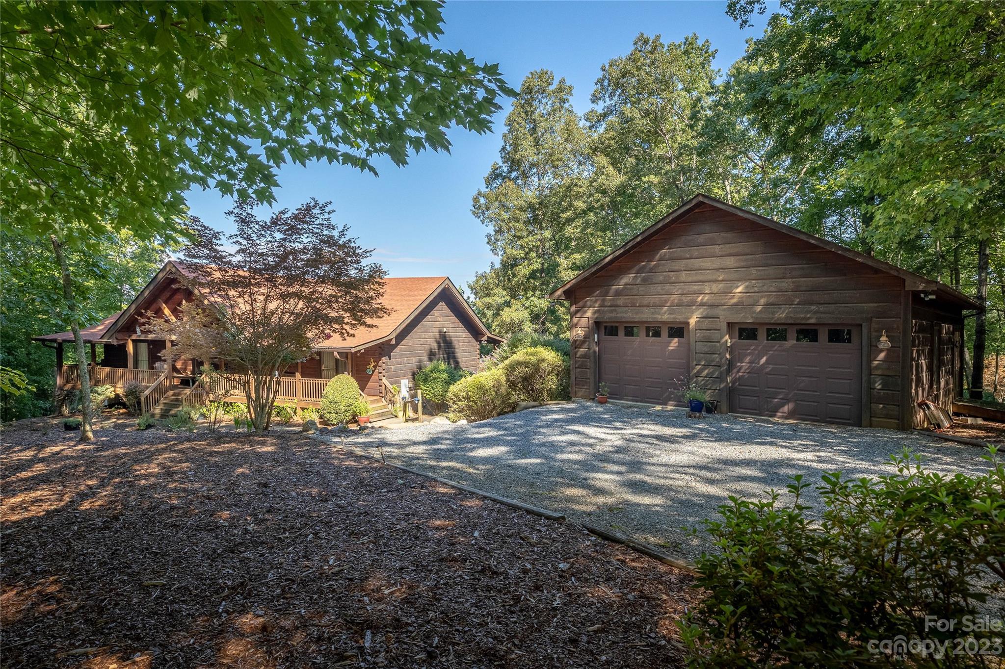 a view of a house with yard and tree s