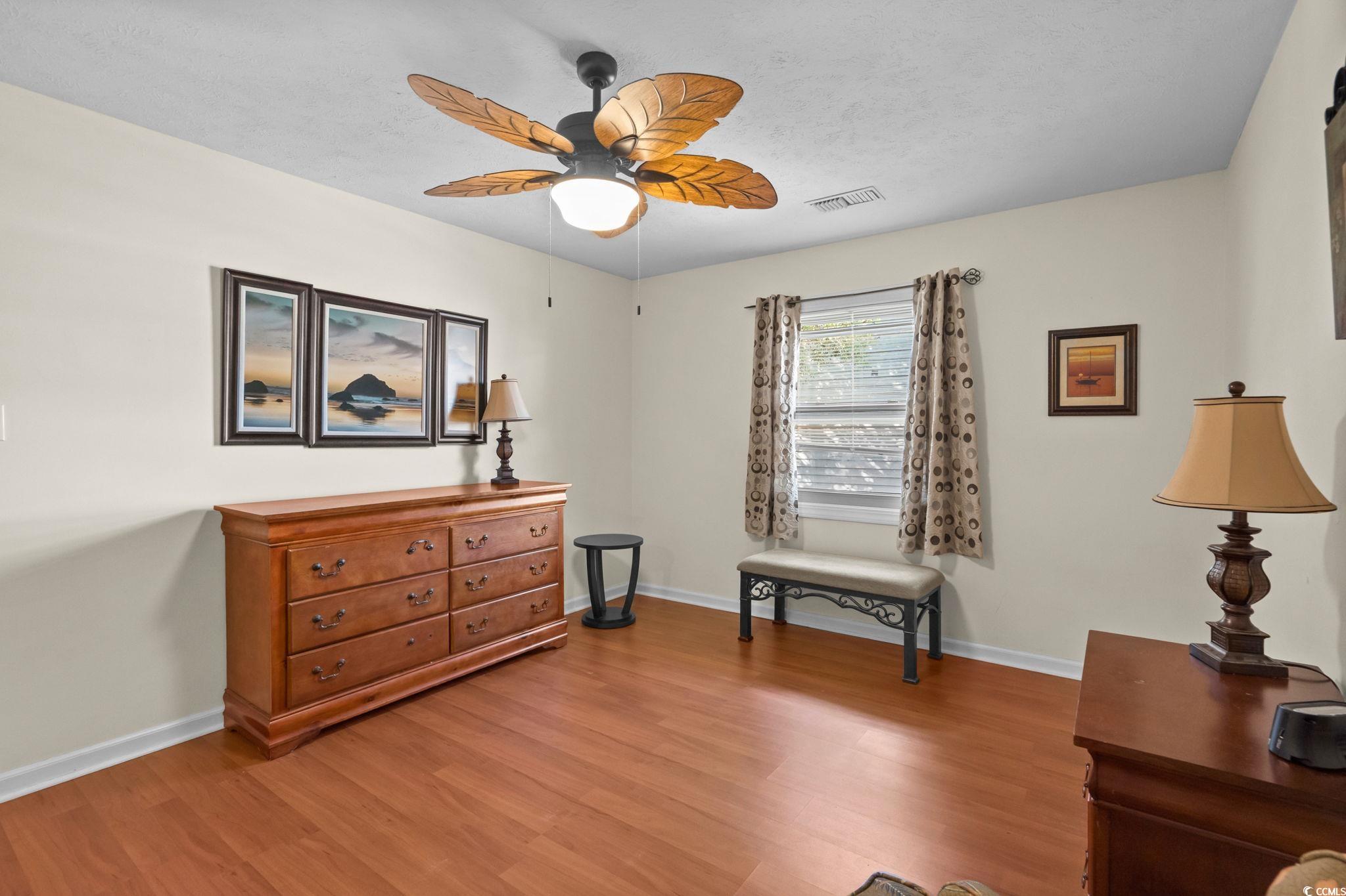 406 75th Avenue North, Unit Q Myrtle Beach, SC 29572 - Photo 13 of 23 Living area with light wood-style flooring and ceiling fan