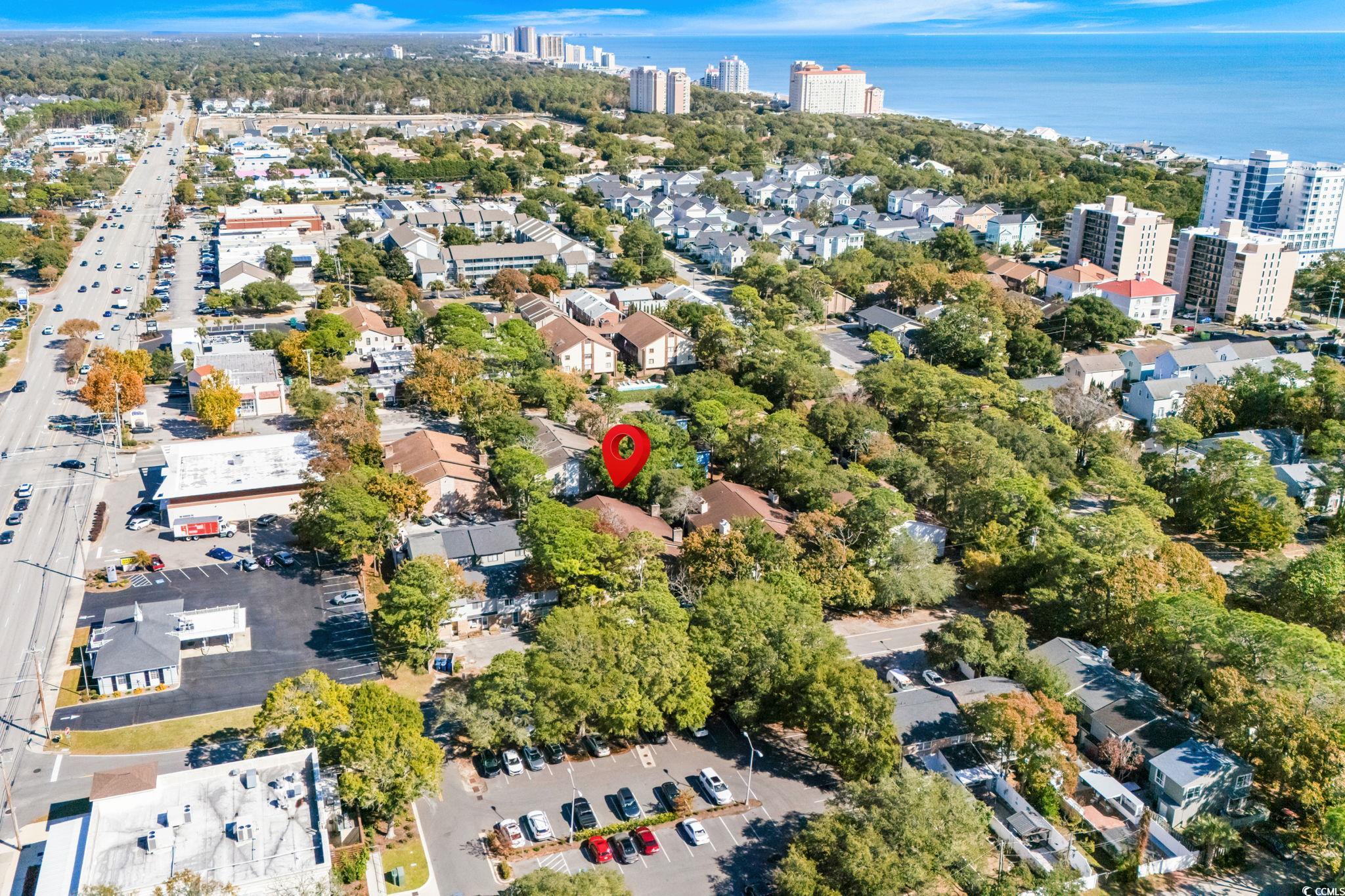 406 75th Avenue North, Unit Q Myrtle Beach, SC 29572 - Photo 22 of 23 Aerial overview of property's location with nearby urban area and a large body of water