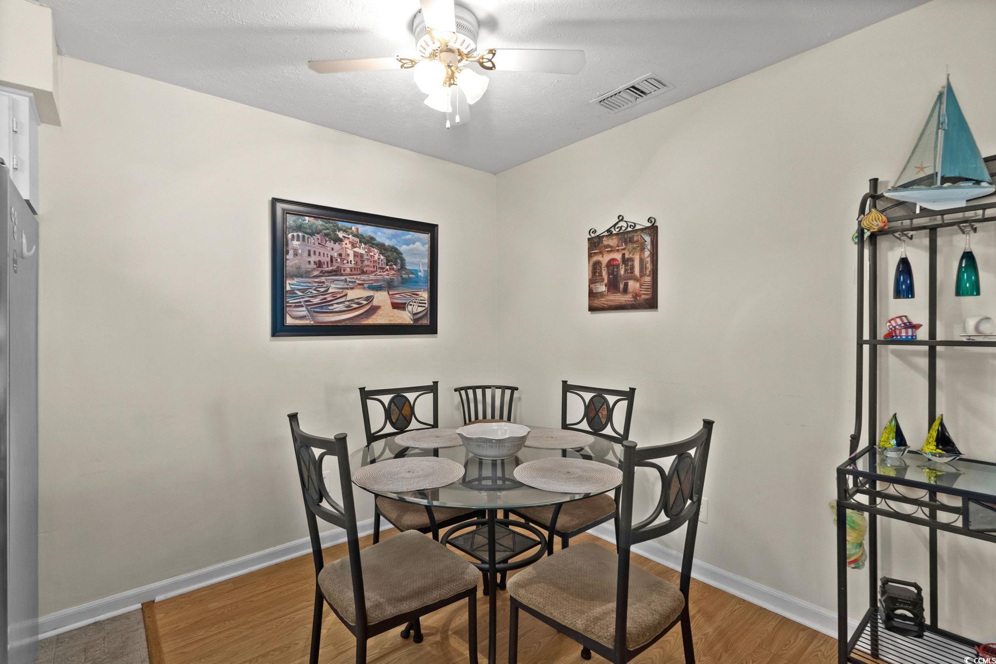 406 75th Avenue North, Unit Q Myrtle Beach, SC 29572 - Photo 10 of 23 Dining space with light wood-type flooring and a ceiling fan