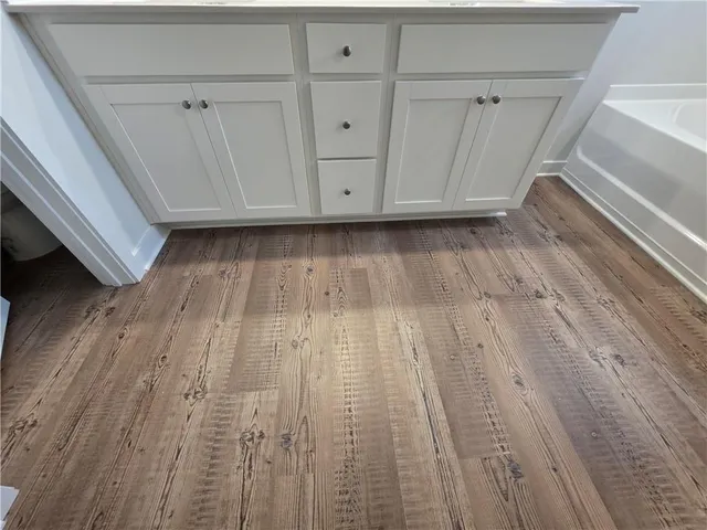 a view of room with wooden floor