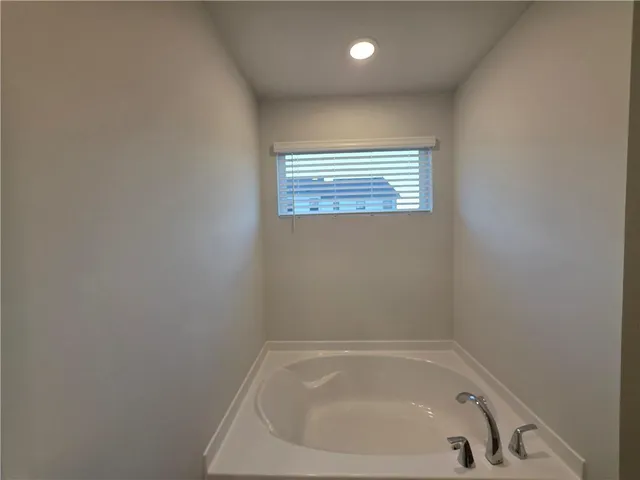 a close up of a bathtub in a bathroom