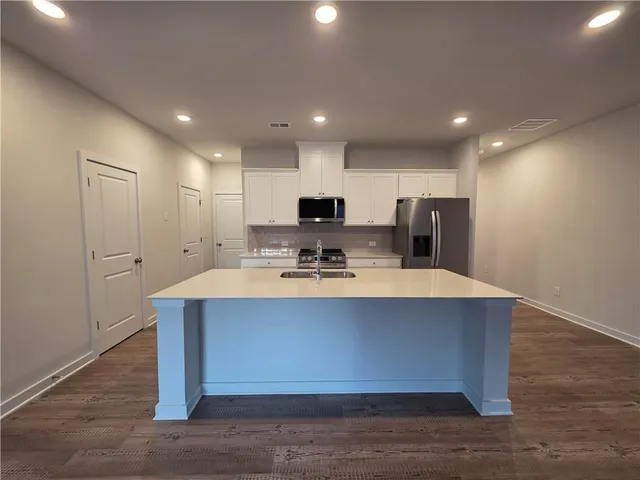 a view of kitchen island with living room