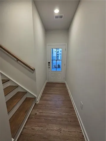 wooden floor in an empty room with windows