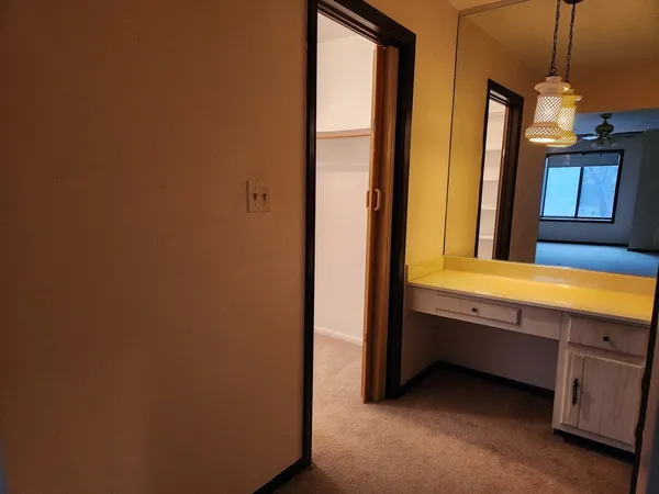 a bathroom with a double vanity sink and a mirror