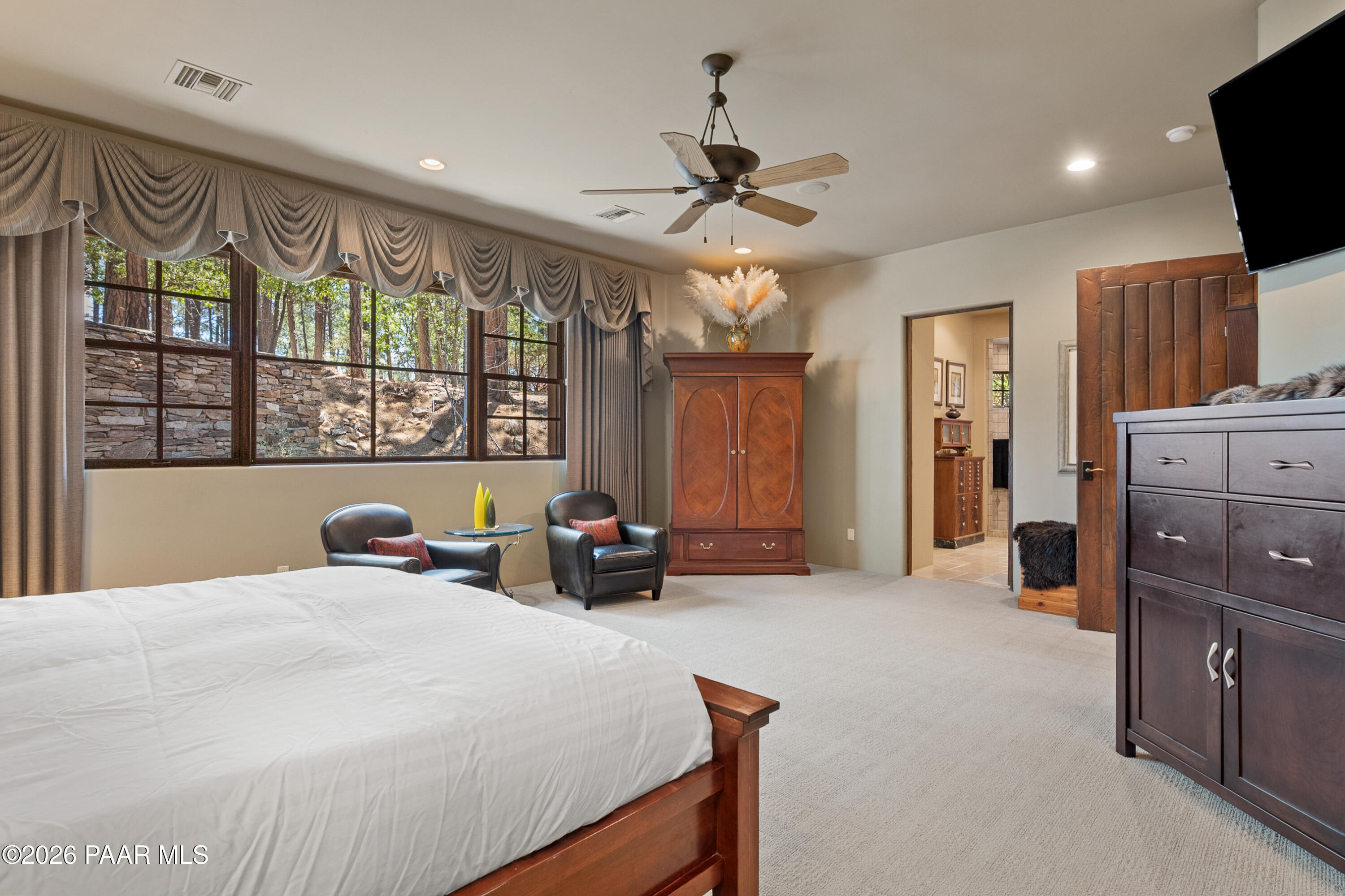 1515 High Valley Ranch Road Prescott, AZ 86303 - Photo 39 of 76 a large bedroom with a bed and a large window