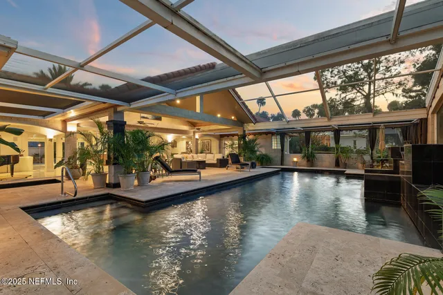 a view of a livingroom with furniture and entryway