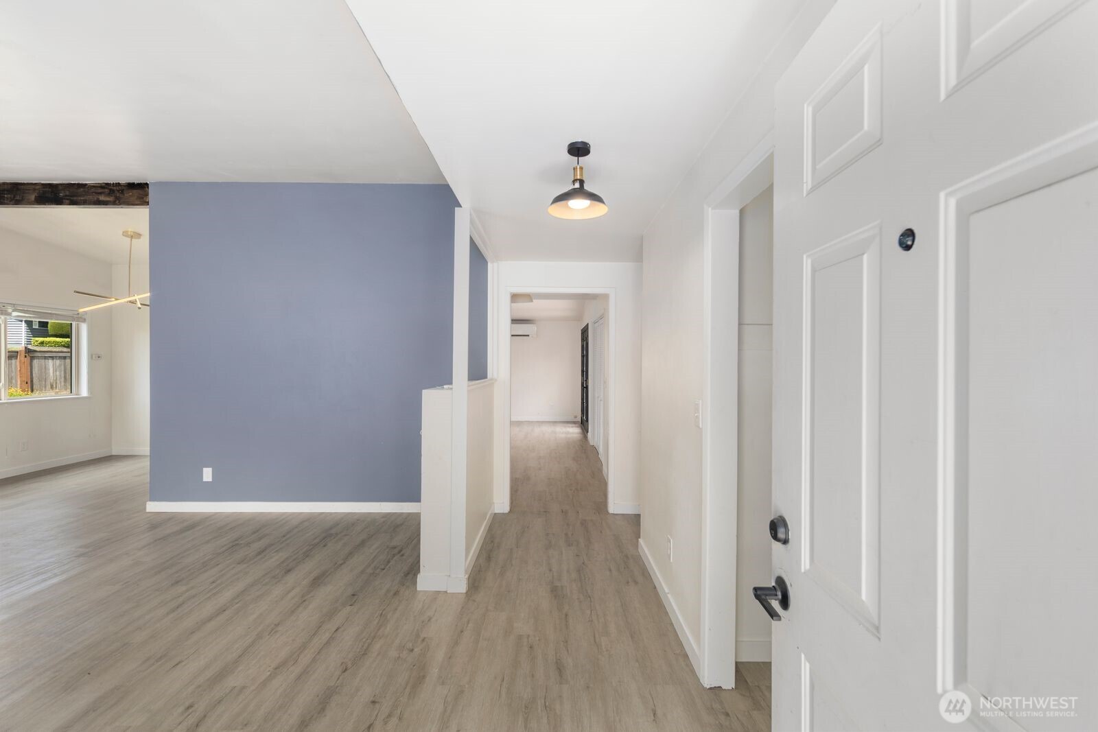 101 161st Street Southeast Bothell, WA 98012 - Photo 5 of 34 a view of a hallway with wooden floor and staircase